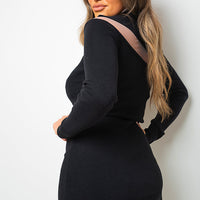 Black ribbed mini dress, high neck long sleeves, side/back view with open back