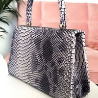 Faux Leather Handbag in Lilac with Top Handle and Chain Strap