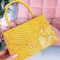 Faux Leather Handbag in Lilac with Top Handle and Chain Strap
