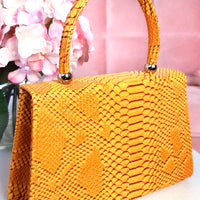 Faux Leather Handbag in Lilac with Top Handle and Chain Strap
