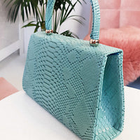Faux Leather Handbag in Lilac with Top Handle and Chain Strap