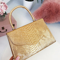 Faux Leather Handbag in Lilac with Top Handle and Chain Strap