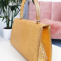 Faux Leather Handbag in Lilac with Top Handle and Chain Strap