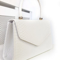 Faux Leather Handbag in Lilac with Top Handle and Chain Strap