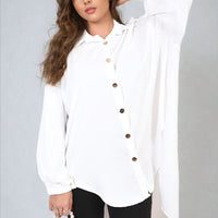 Oversized collared white button-down top with front buttons and gathered sleeve cuffs