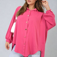 Oversized pink button-down shirt with pointed collar and long sleeves, front buttons