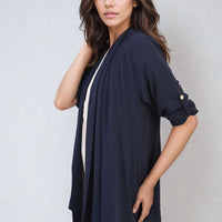 Dark navy open-front cardigan with rolled short sleeves and button detail