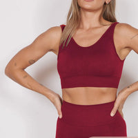 Magenta seamless petite sports bra with racer back, cropped fit