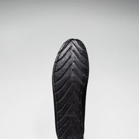Driving loafer outsole with textured tread and heel grip