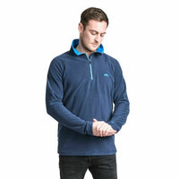 Man wearing a navy microfleece quarter-zip top with blue collar lining