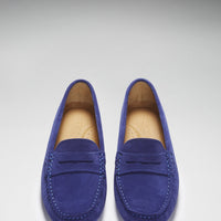 Top view of matching ink blue suede loafers with penny straps and stitched toes
