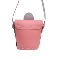 Pastel pink leather barrel bag with daisy top and flap closure, crossbody strap
