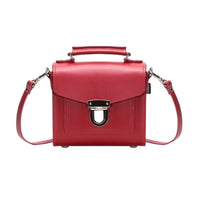 Red leather sugarcube handbag with front flap and silver buckle, top handle, crossbody straps