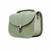 Sage green leather satchel bag with flap, silver clasp, and side detail