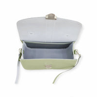 Open sage green flap bag showing lined interior and hanging strap