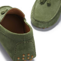 Green suede loafer heel with tan grip studs and brown lining