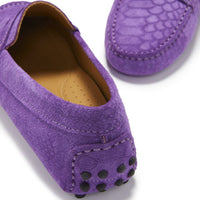 Close-up of purple suede loafer heel with black rubber grip studs