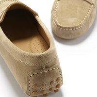 Taupe suede driving loafer heel with rubber grip studs and a perforated insole