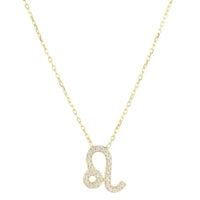Gold zodiac pendant necklace with Leo symbol charm and crystal accents