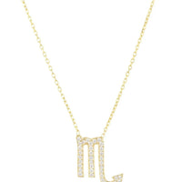 Gold zodiac pendant necklace with sparkling Scorpio glyph on a thin chain