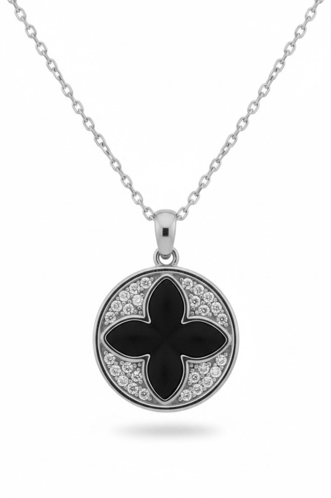 Silver necklace with round black four-leaf clover pendant and sparkling halo stones