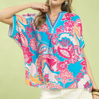 Oversized blue printed top with pink floral paisley, V-neck, short sleeves