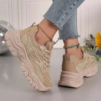 Beige chunky platform sneakers, side profile with lace-up mesh and stacked tread sole.