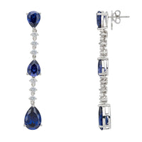Silver drop earrings showing post and clasp with blue teardrop stones and crystals