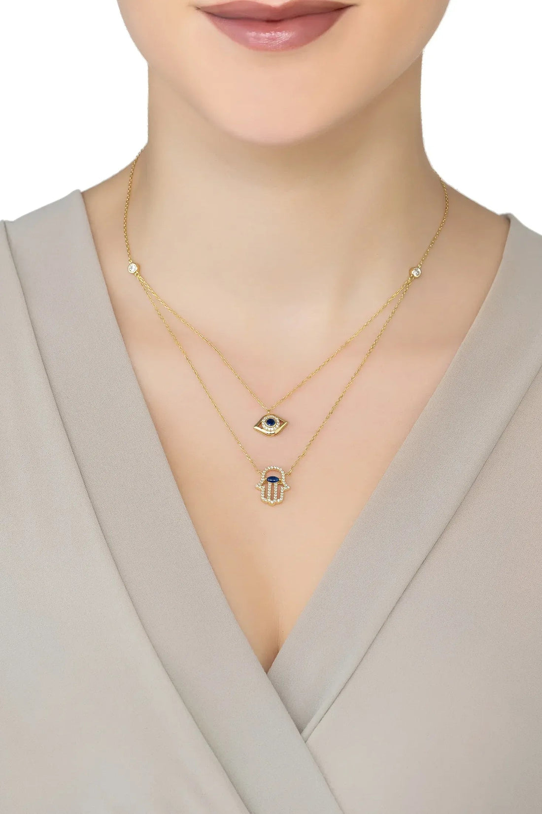 Gold layered hamsa and evil eye pendant necklace, layered chain with blue details