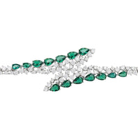 Silver tennis bracelet featuring emerald green oval stones in two rows