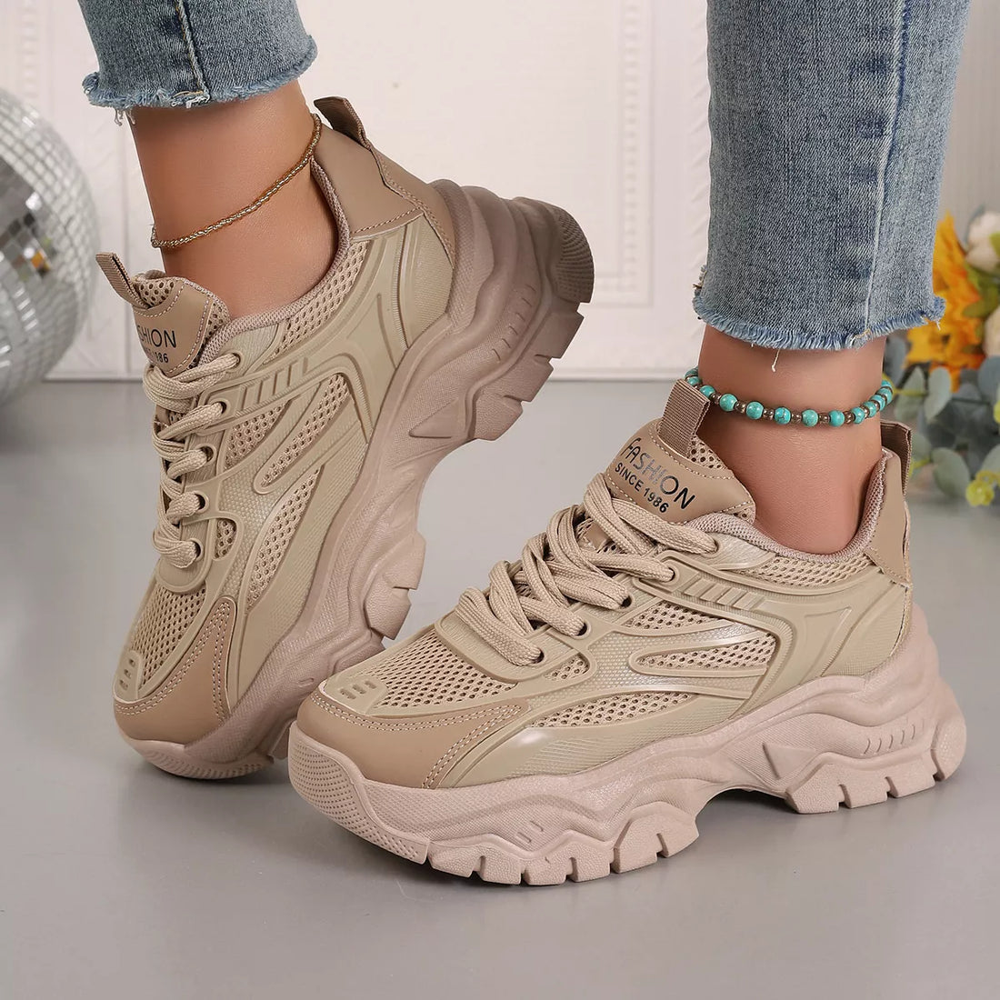 Khaki chunky platform sneakers, lace-up mesh upper with thick platform sole and heel panel.