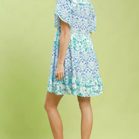 Blue floral tiered mini dress with flutter sleeves, full side view