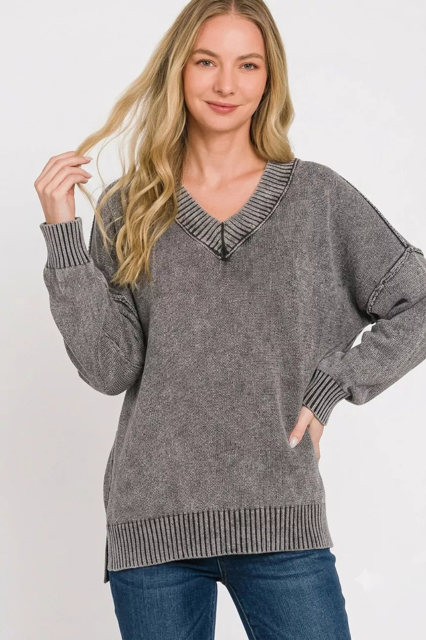Washed dark gray oversized sweater with deep V-neck and relaxed fit