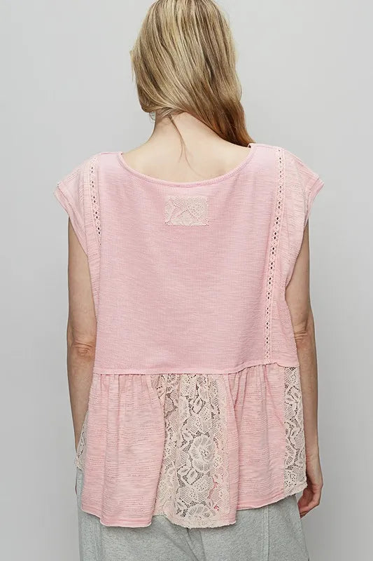Blush pink lace peplum blouse with embroidered back yoke, cap sleeves—back view