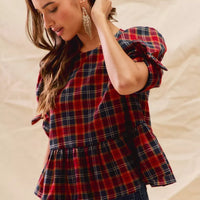 Red plaid peplum top with ribbon-tied sleeves and gathered waist detail