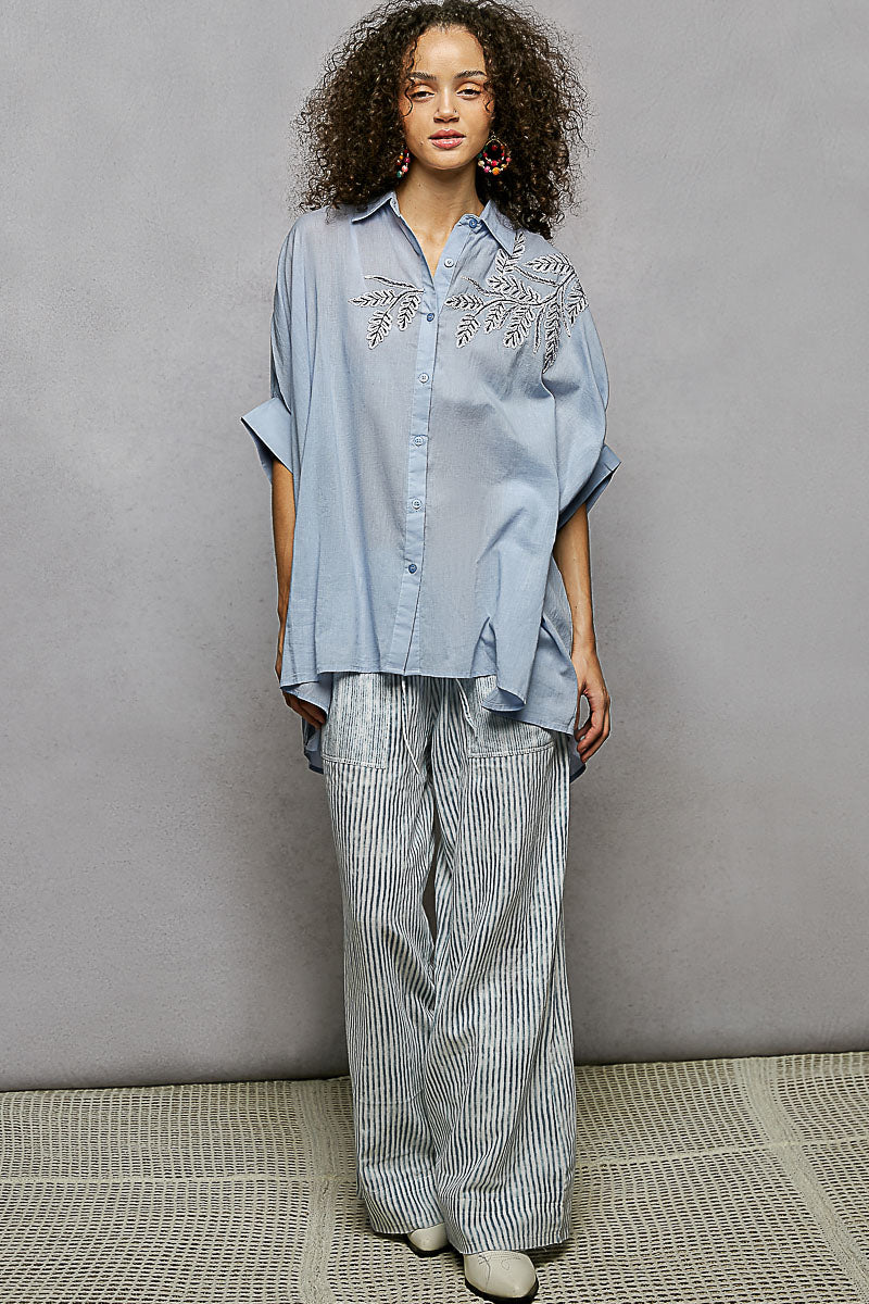 Sky blue button-down embroidered high-low hem shirt with front button placket