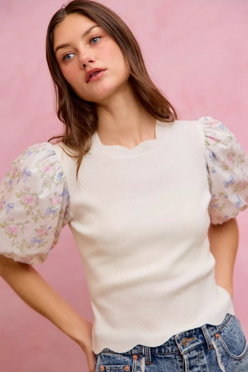 White knit sweater top with floral puff sleeves and ribbed crew neckline