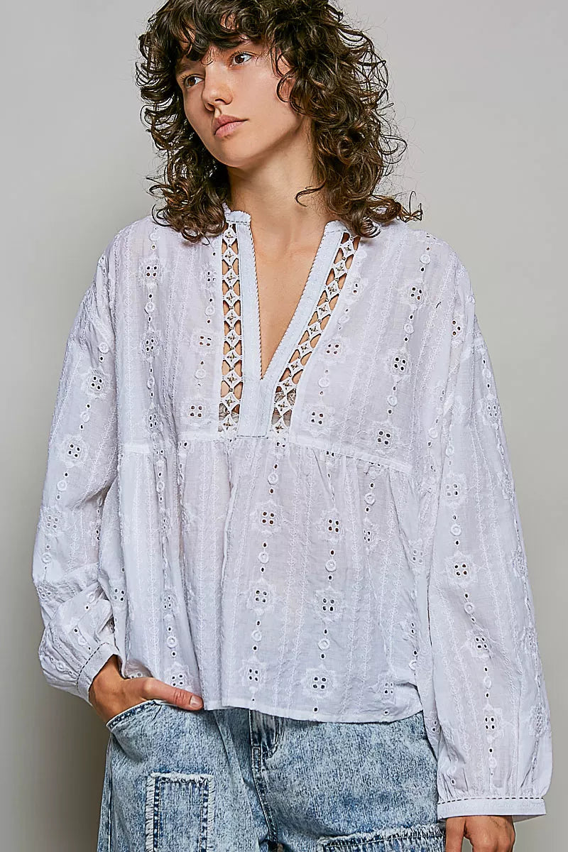 Off-white cotton V-neck blouse with lace trim and long balloon sleeves