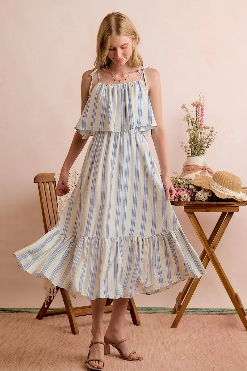 Blue and white striped midi dress with tiered hem and tie shoulder straps