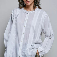 Ivory lightweight woven shirt with ruffle trim round neck and button front