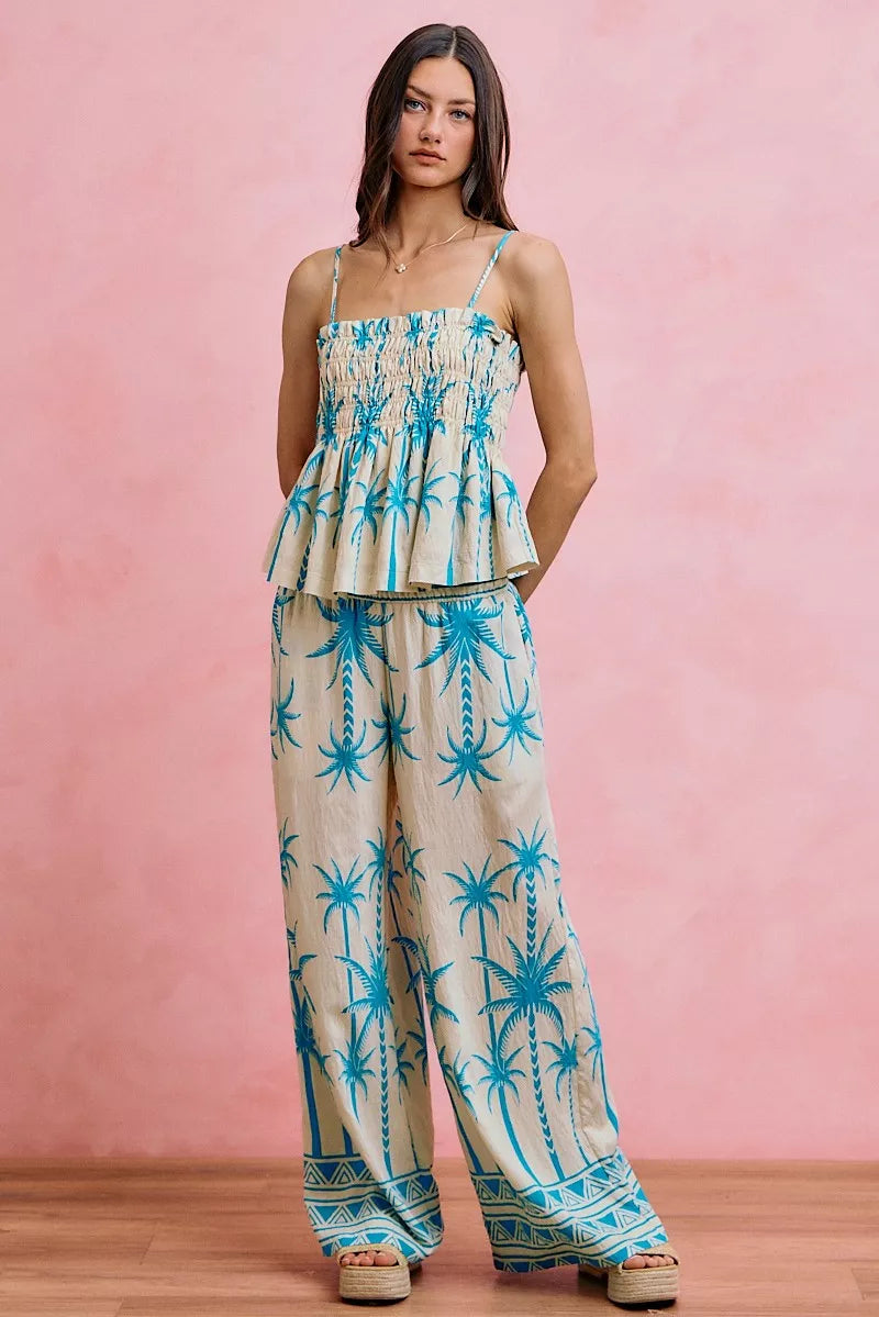 Blue palm tree print adjustable cami top with smocked bodice and layered ruffles