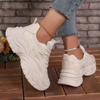 White lace-up chunky platform sneakers with textured side and thick ridged sole