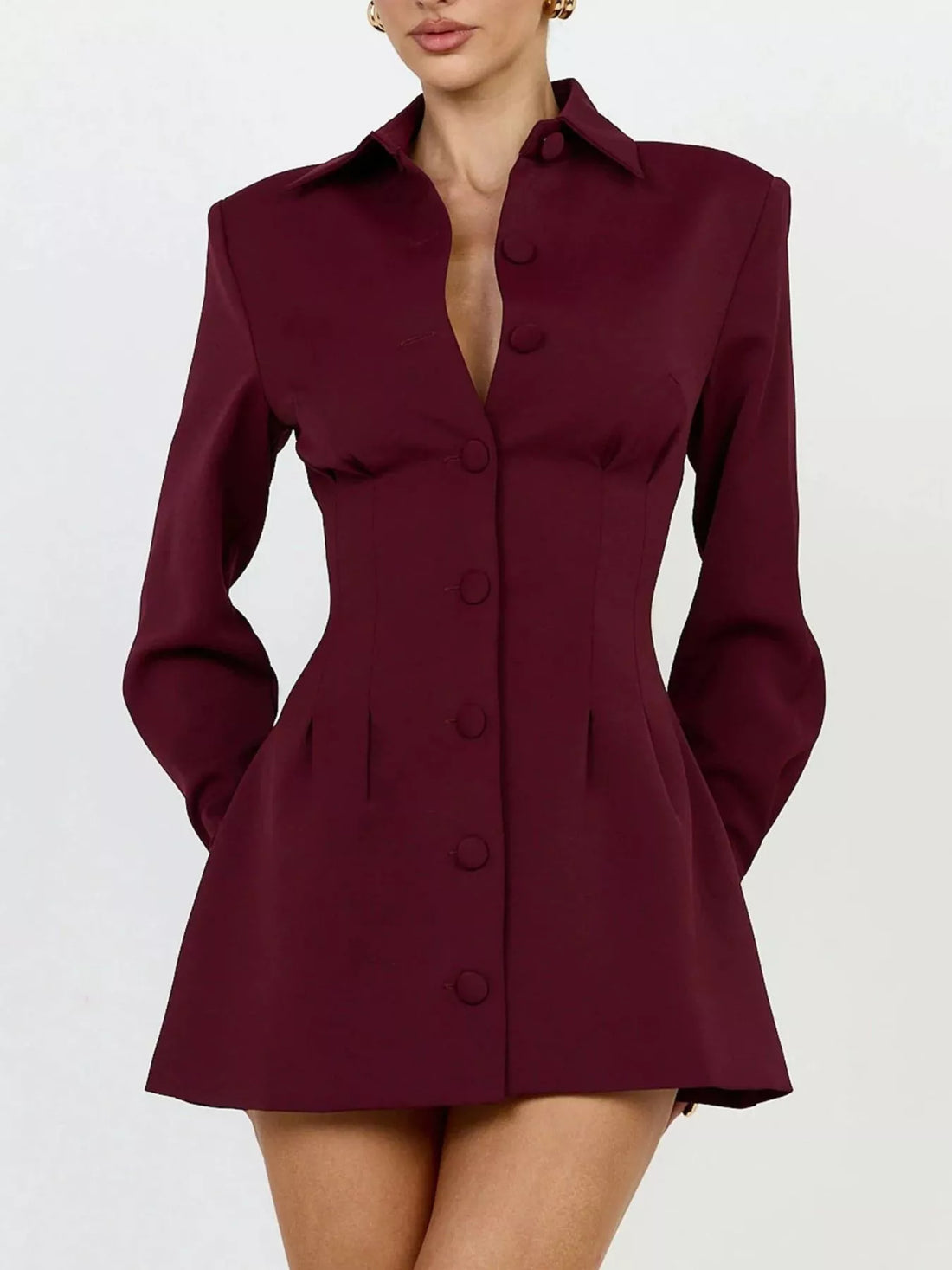 Wine red blazer mini dress with notched collar, long sleeves, and row of round buttons.