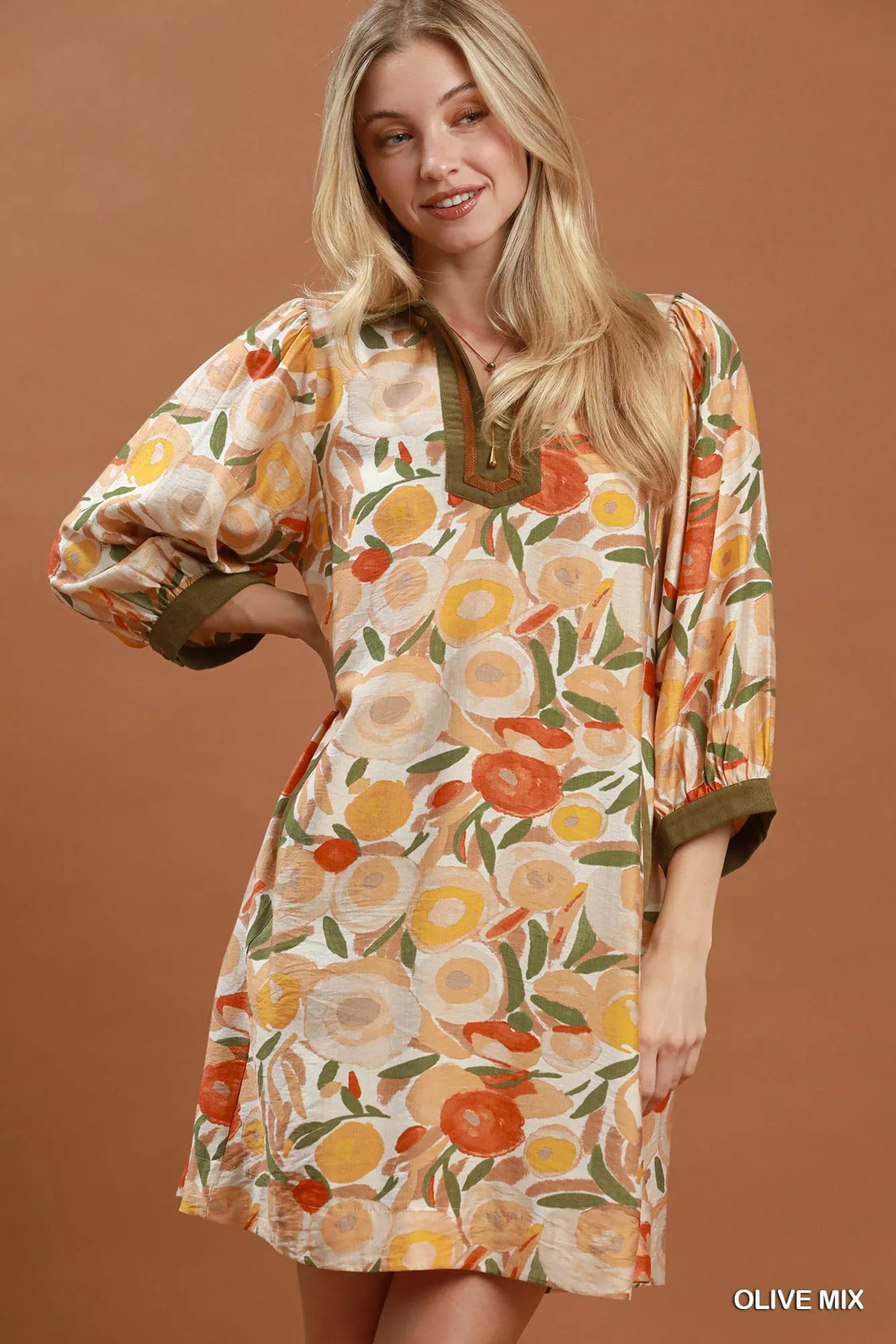 Floral shift mini dress with olive contrast trim and three-quarter puff sleeves