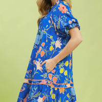 Blue floral mini dress with ruffled puff sleeves and tie belt detail
