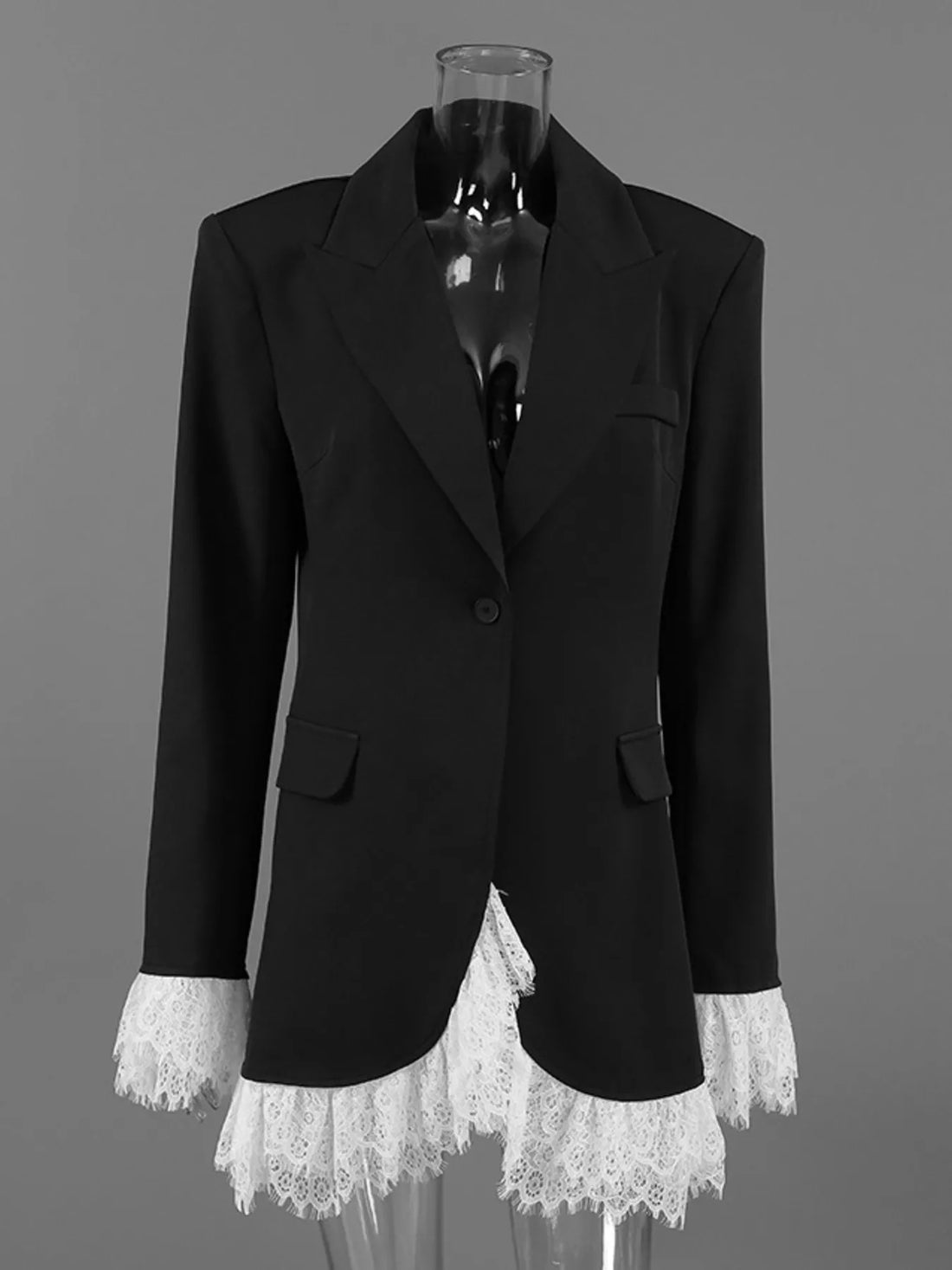 Black lace-hem one-button blazer on a mannequin, flap pockets