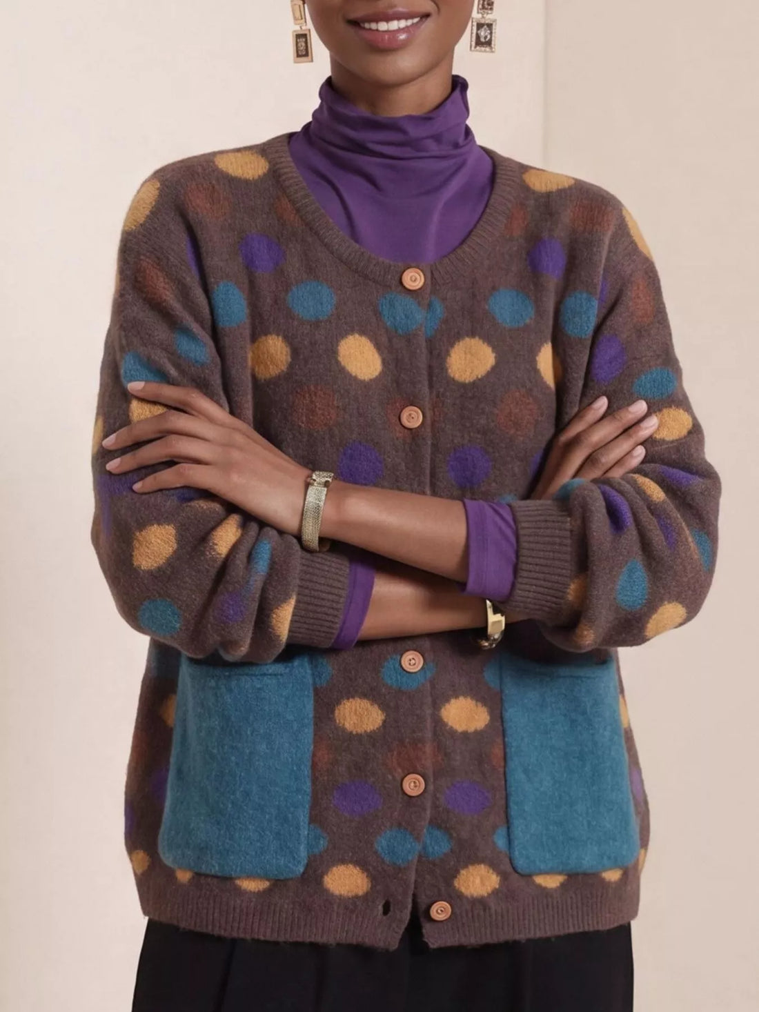 Plus-size brown polka-dot button cardigan with two blue patch pockets, ribbed hem and cuffs