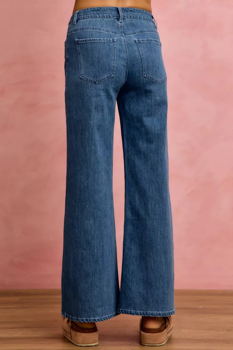 Mid-rise stretch denim jeans, back view with two patch pockets and belt loops