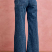 Mid-rise stretch denim jeans, back view with two patch pockets and belt loops