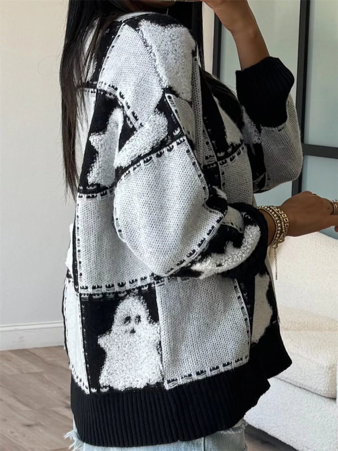 Black/white ghost patchwork checkered sweater with long sleeves and ribbed bottom